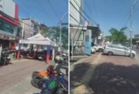 Trotoar di Jalan Poros Sultan Hasanuddin, Gowa, disalahgunakan untuk tenda usaha dan parkir kendaraan, mengganggu hak pejalan kaki.
